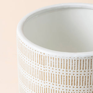 A close up of sandy beige ceramic pot, showing its smooth texture and dimension in 9.4 inches.