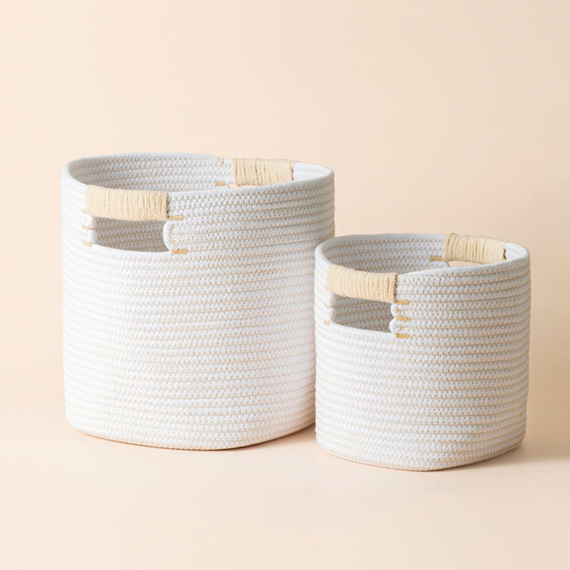 A pair of round storage baskets in different sizes, made of silky white cotton rope.