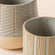 A close view of two gray and beige pots, showing their different dimensions in 5.5 and 4.6 inches.