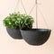 A set of two speckled black hanging pots in same sizes, made from recyclable plastic and natural stone powders.