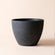 A full view of speckled black planter pot, made of plastic and stone powders.