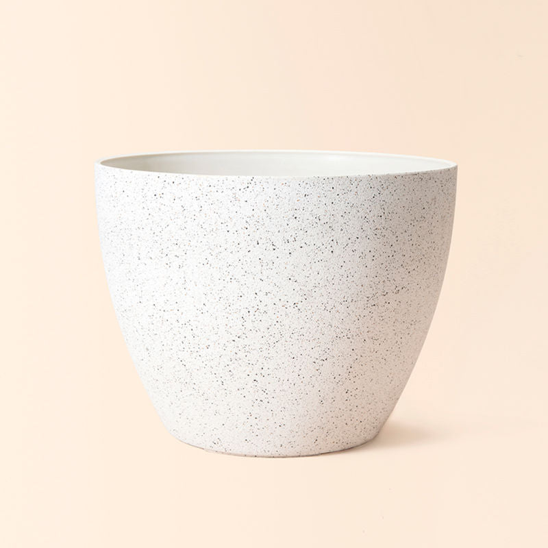 A full view of large planter in speckled white color, made from recyclable plastic and natural stone powders.