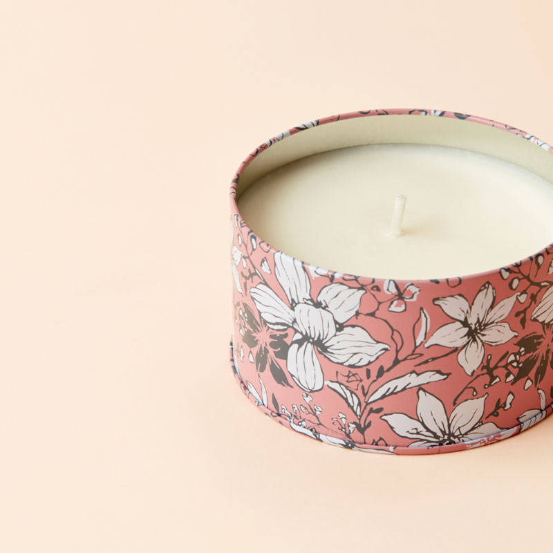 A close up of Sunkissed Rose candle, showing its cotton wick.