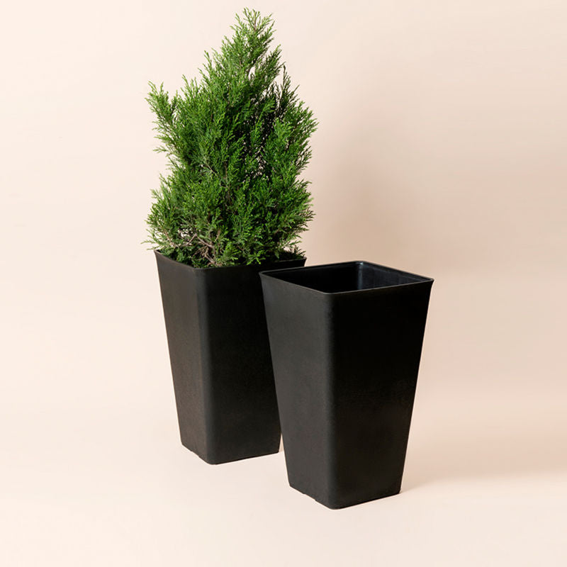 A set of two black tall planters in same size, made of plastic and natural stone powder.