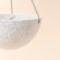 A close up of two-tier white hanging planter, showing its sturdy rope and dimension in 10.8 inches.