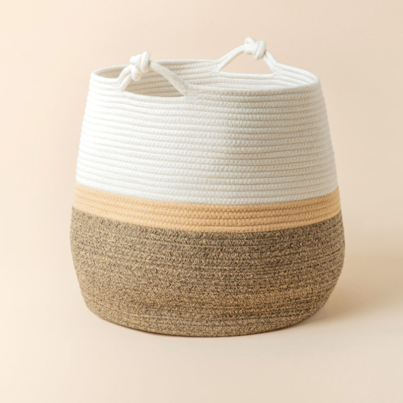 A full view of tri-colored woven basket, made of natural cotton rope.
