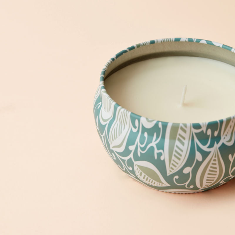 A close up of Orange and Blossom candle, showing its cotton wick.