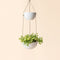 A full view of two-tier speckled white hanging planter, made from recyclable plastic and natural stone powders.