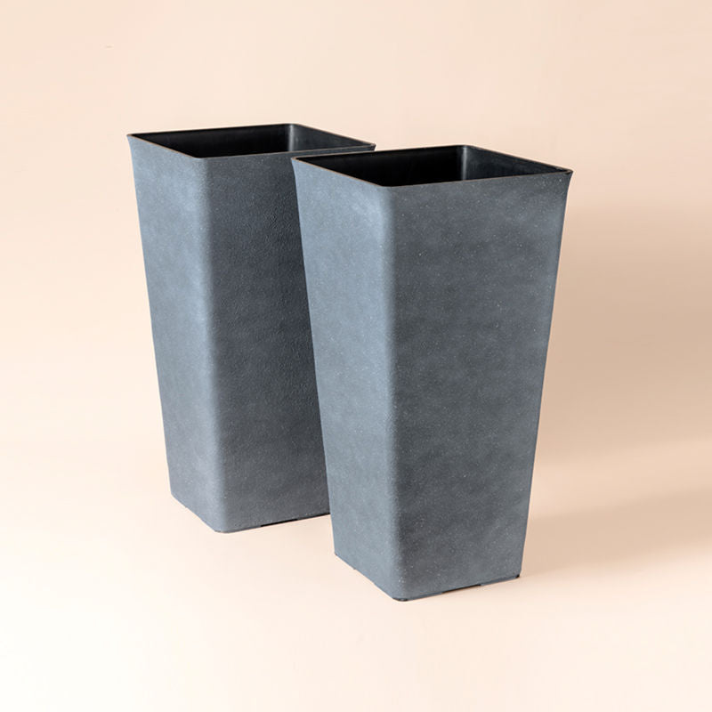 A set of two gray planters in trapezoid-shaped is made of plastic.