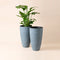 A set of two tall planters in weathered gray color, made from recyclable plastic and stone powders.