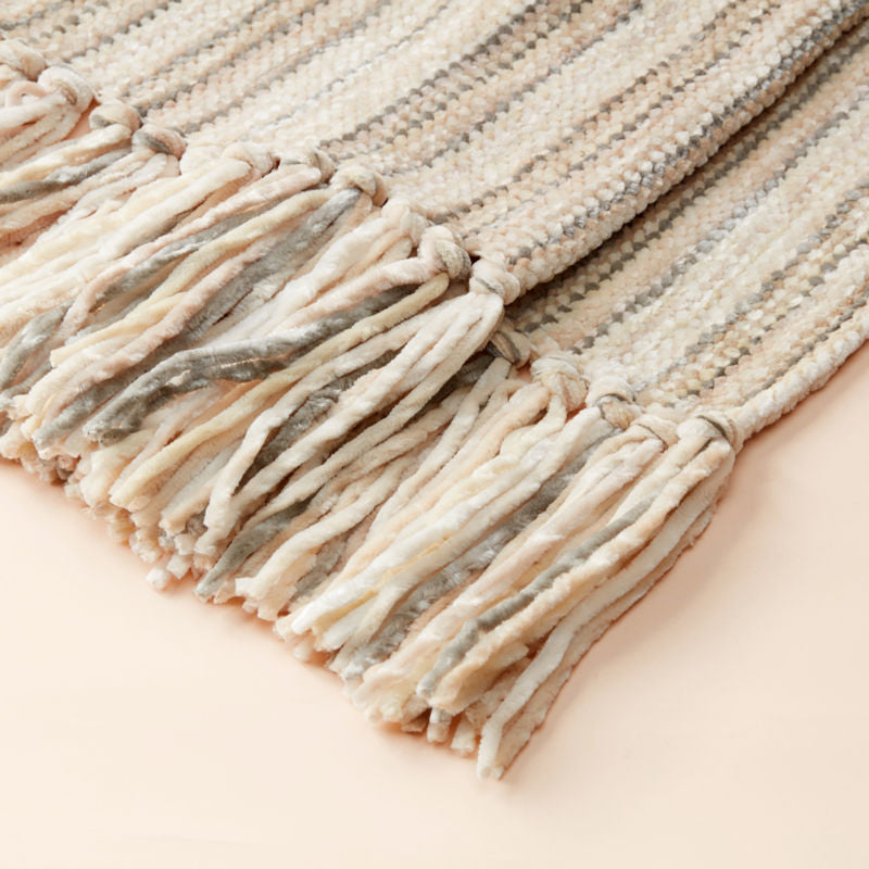 A detailed photo of the tassels on the woven chenille throw blanket.