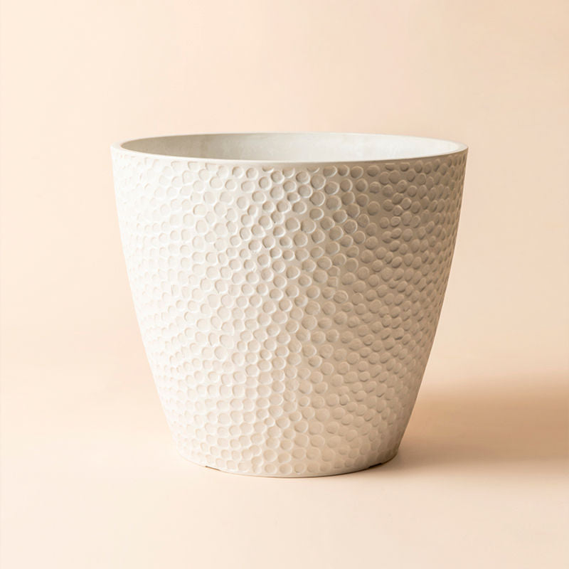 The full view of the 14-inch white pot with honeycomb patterns. The planter is made of recyclable plastic.