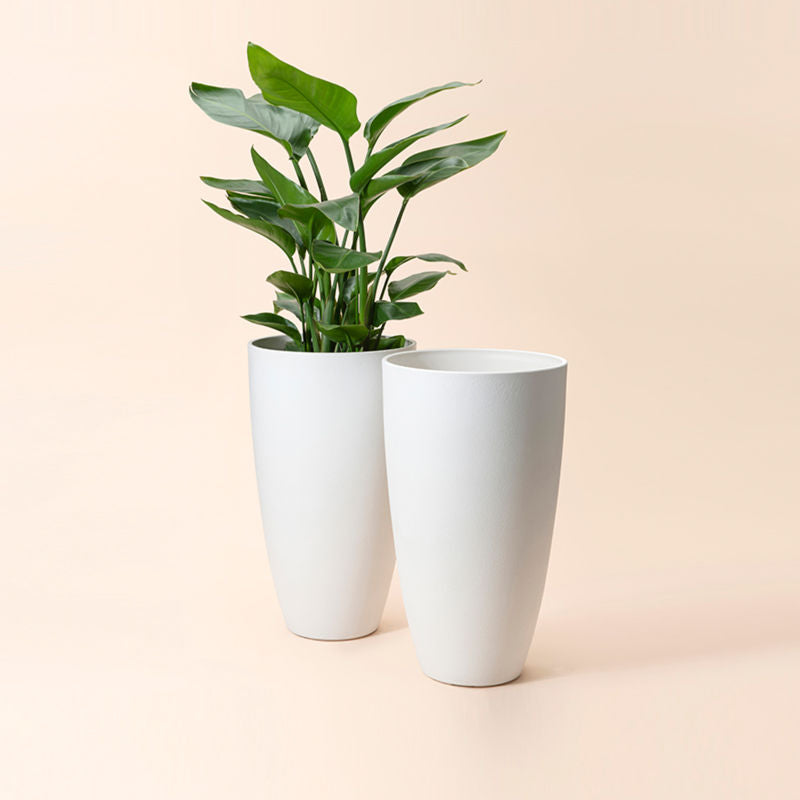 A set of two white tall pots in same size, made from recyclable plastic and natural stone powders.